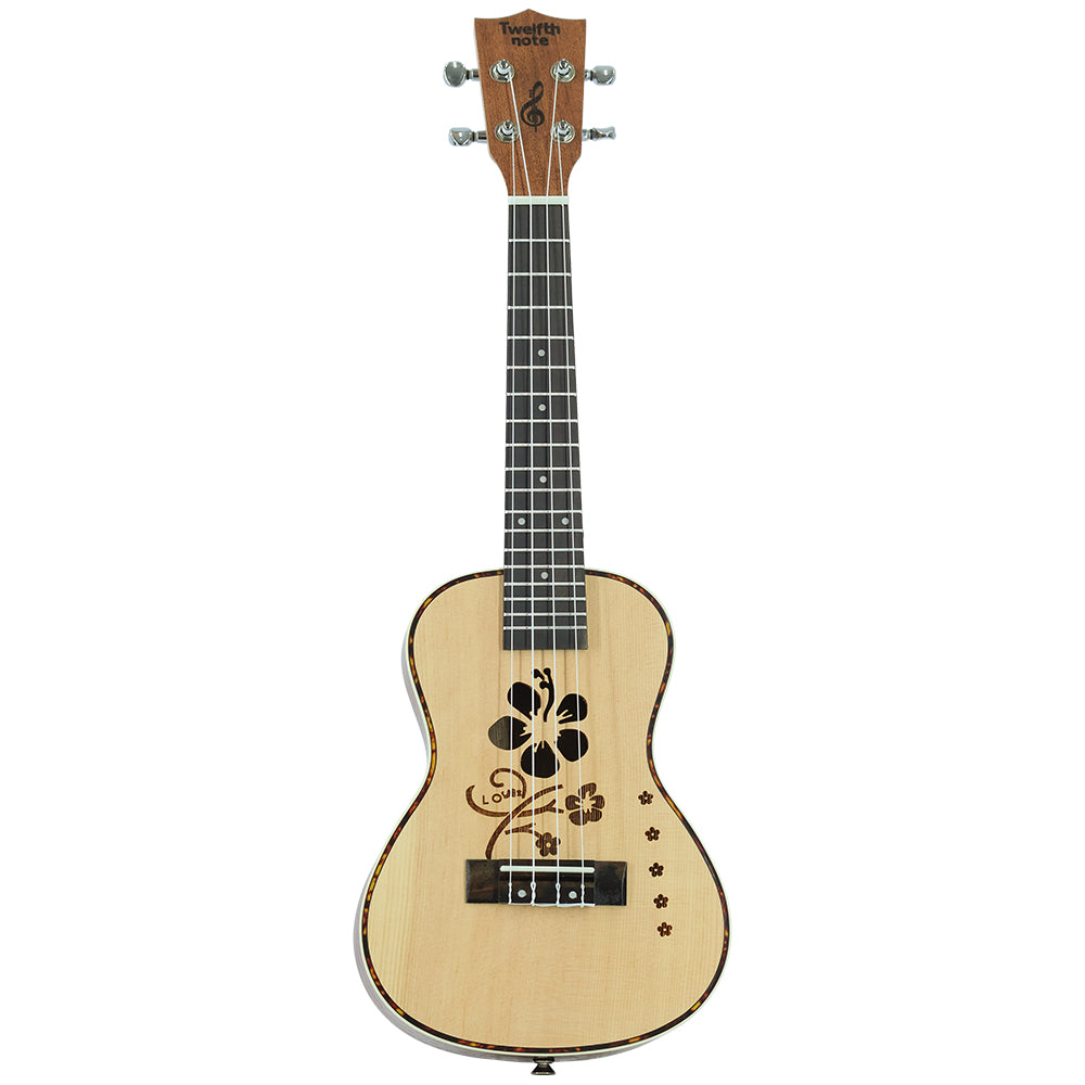 Twelfth Note Crafted Series acoustic ukulele featuring a laser-engraved floral hibiscus motif and tortoise-style body binding