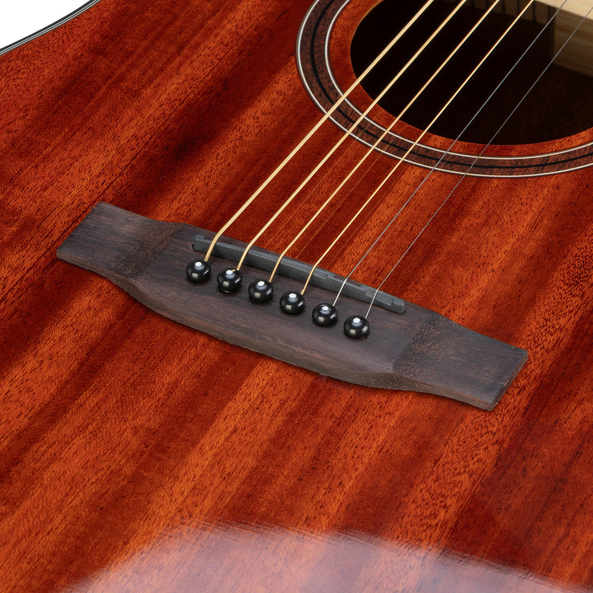 Twelfthnote G72H acoustic guitar featuring a rich mahogany solid wood body and a detailed wood sticker rosette.