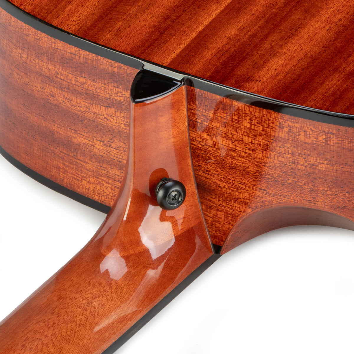 Twelfthnote G72H acoustic guitar neck joint showing glossy mahogany solid wood construction and black strap button