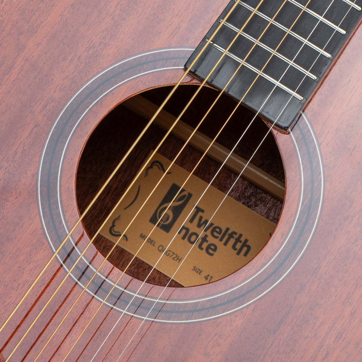 Twelfthnote G72H acoustic guitar featuring a solid mahogany body, rosewood fretboard, and wood sticker rosette