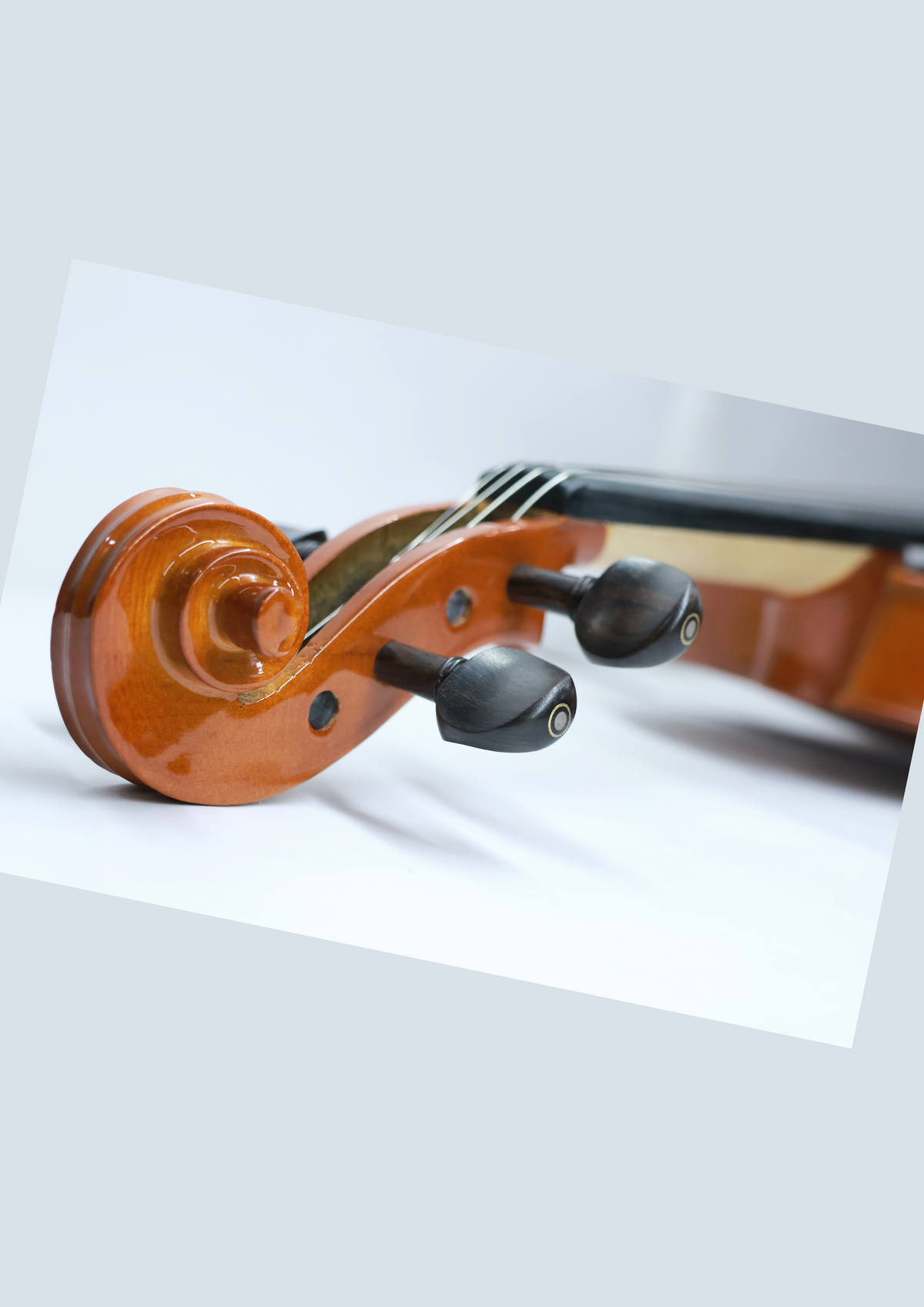 Twelfthnote V07 violin scroll and ebony tuning pegs with a polished spruce and maple finish